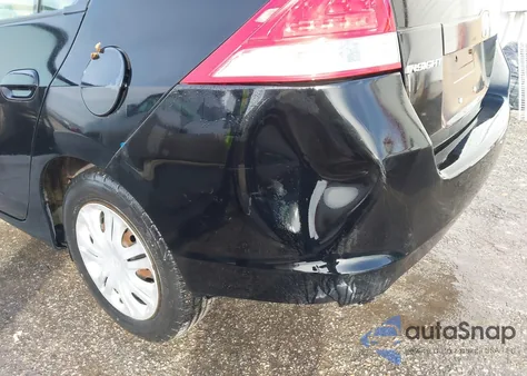 2011 Honda Insight from USA, damaged, VIN JHMZE2H36BS000609